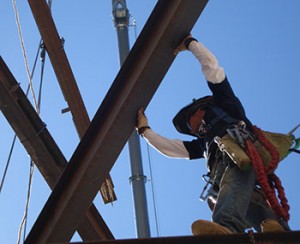 J.B. Steel worker practicing safety while up on a beam.